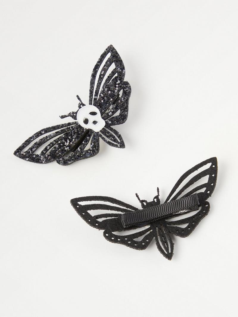 2-pack butterfly hair clips with glitter and skulls | Lindex Europe