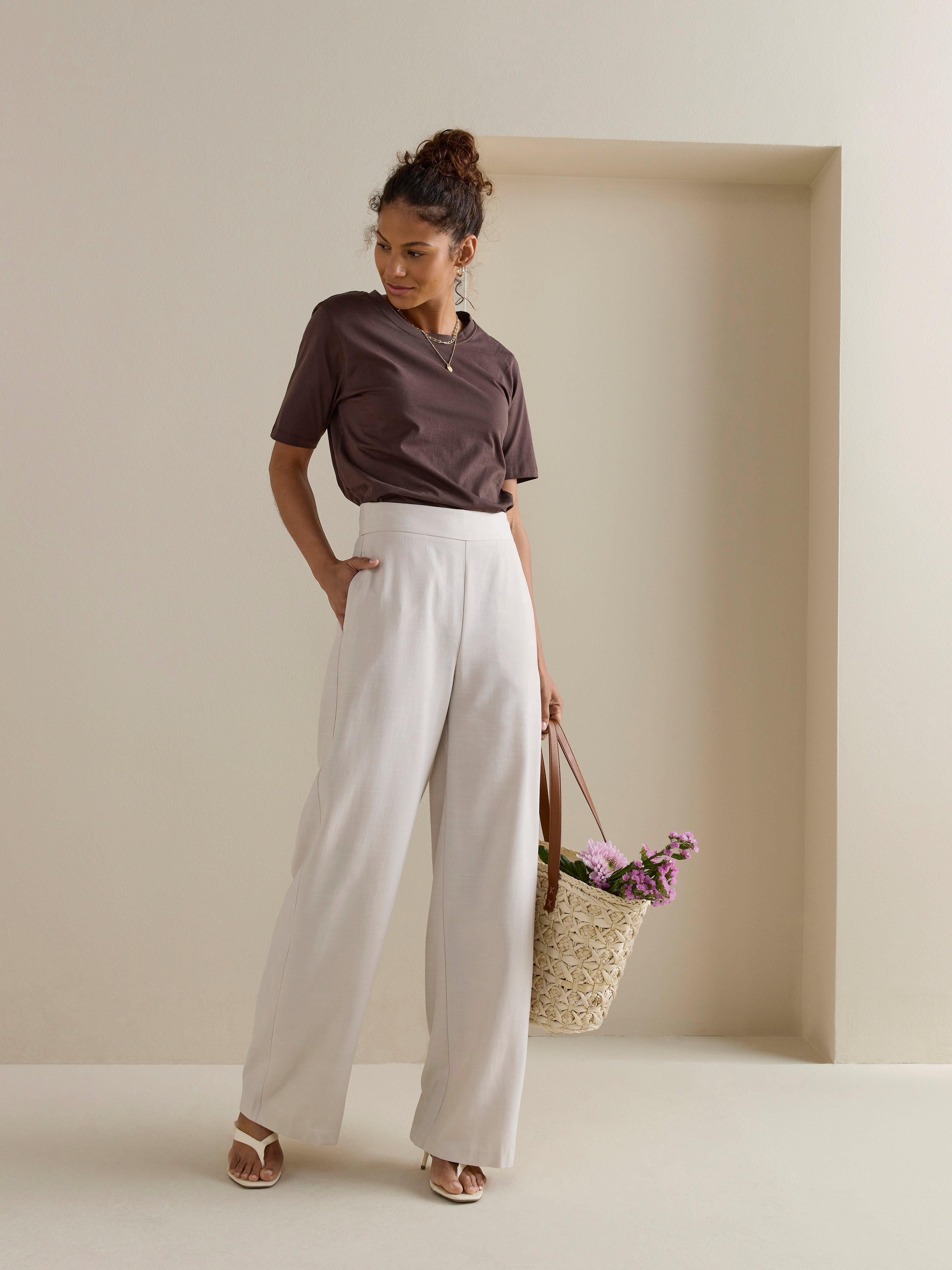 beige high waisted trousers