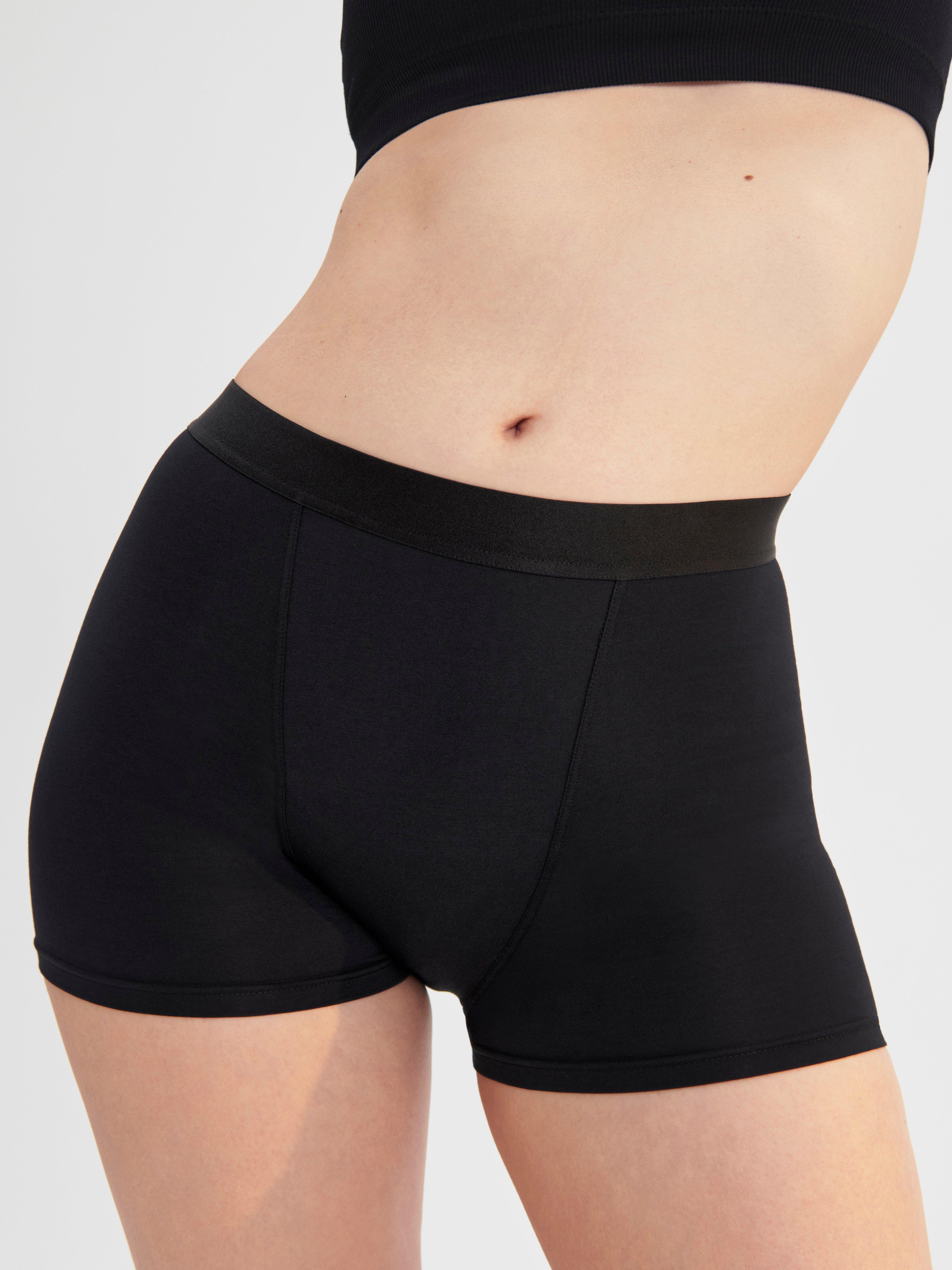 A woman in a pair of black Boxer period-proof panties.