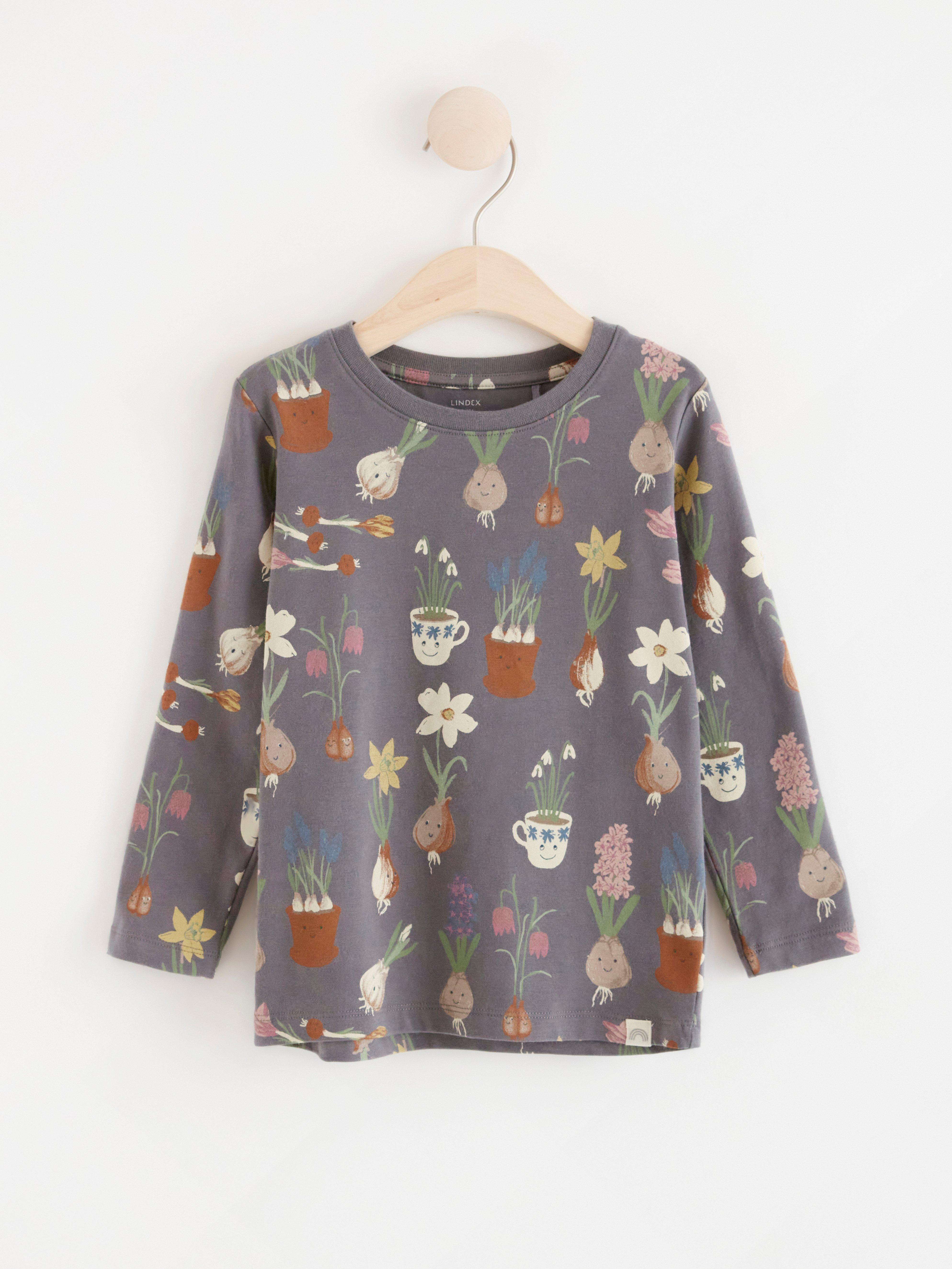 Långärmad topp med blommor