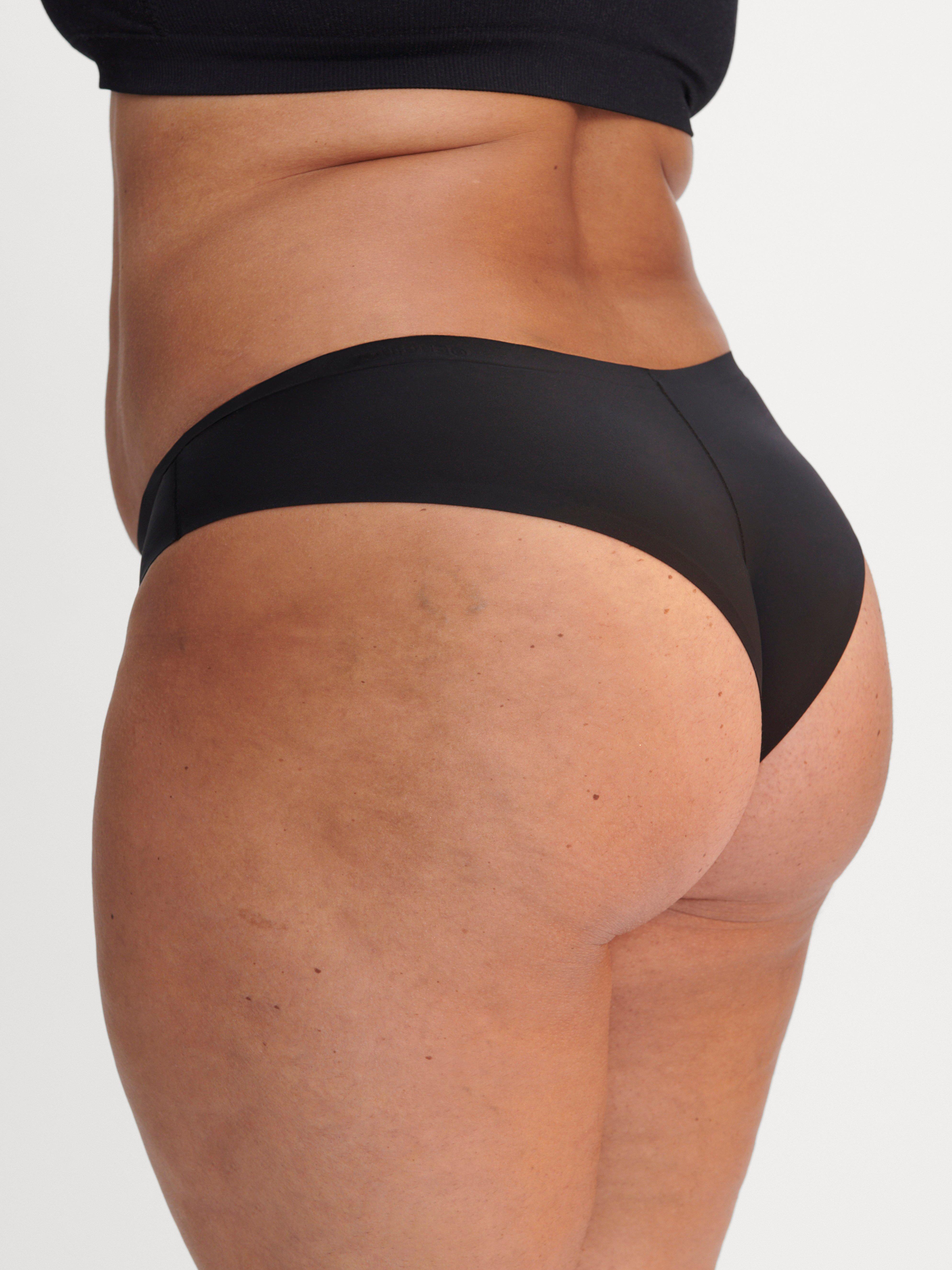 A woman in a pair of black Brazilian period-proof panties.