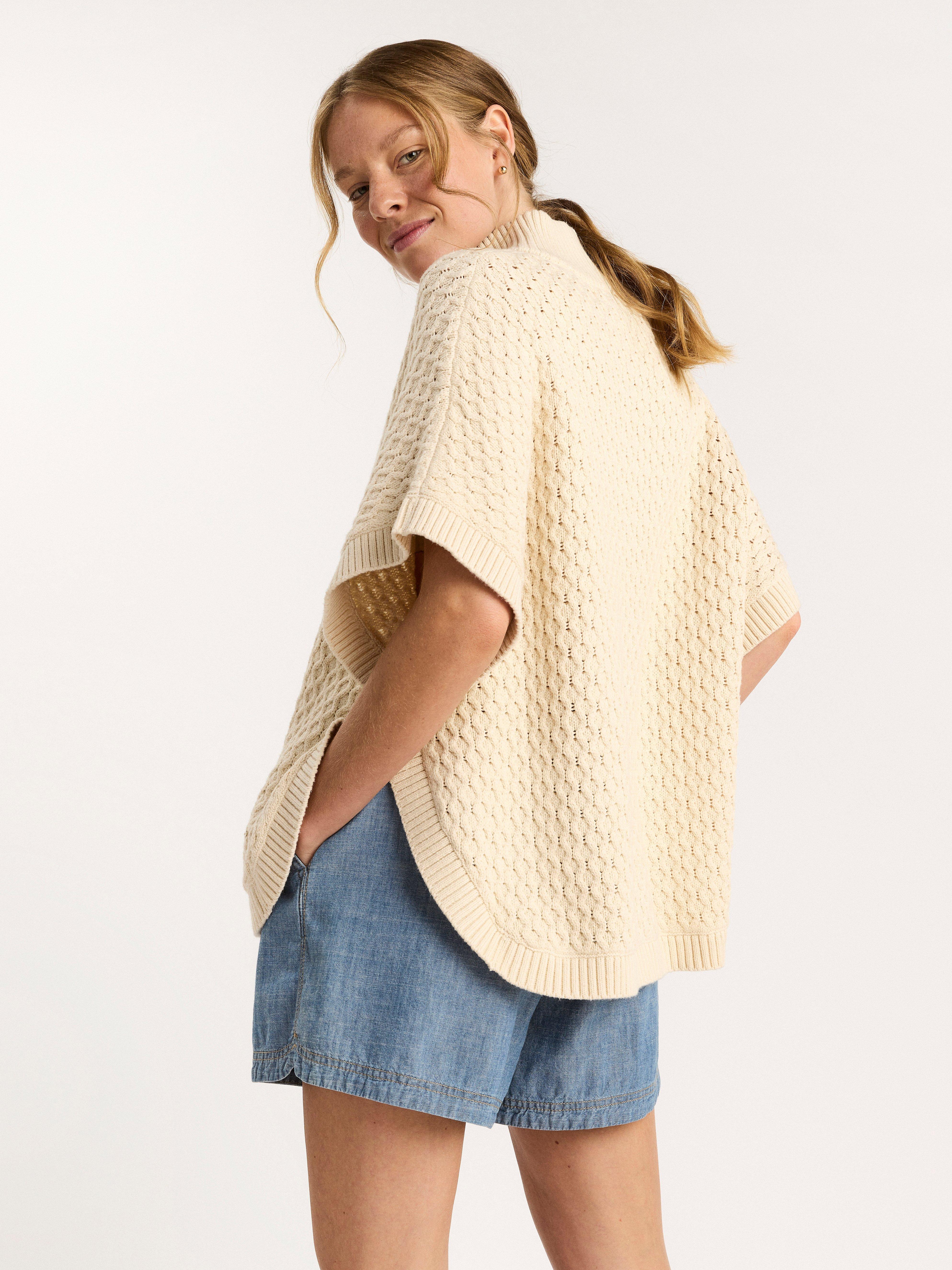 Stickad poncho