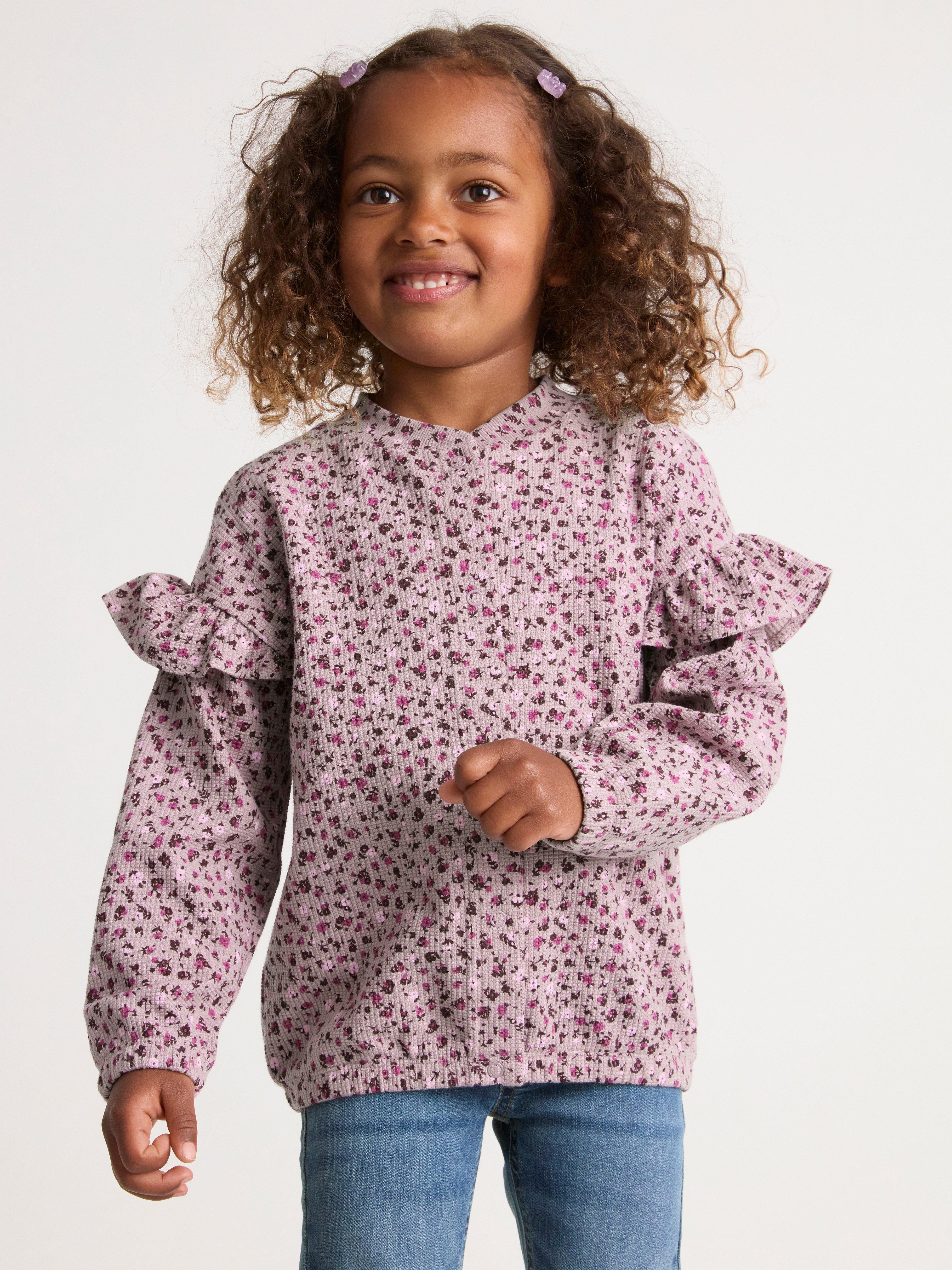 Cardigan med volang på axeln