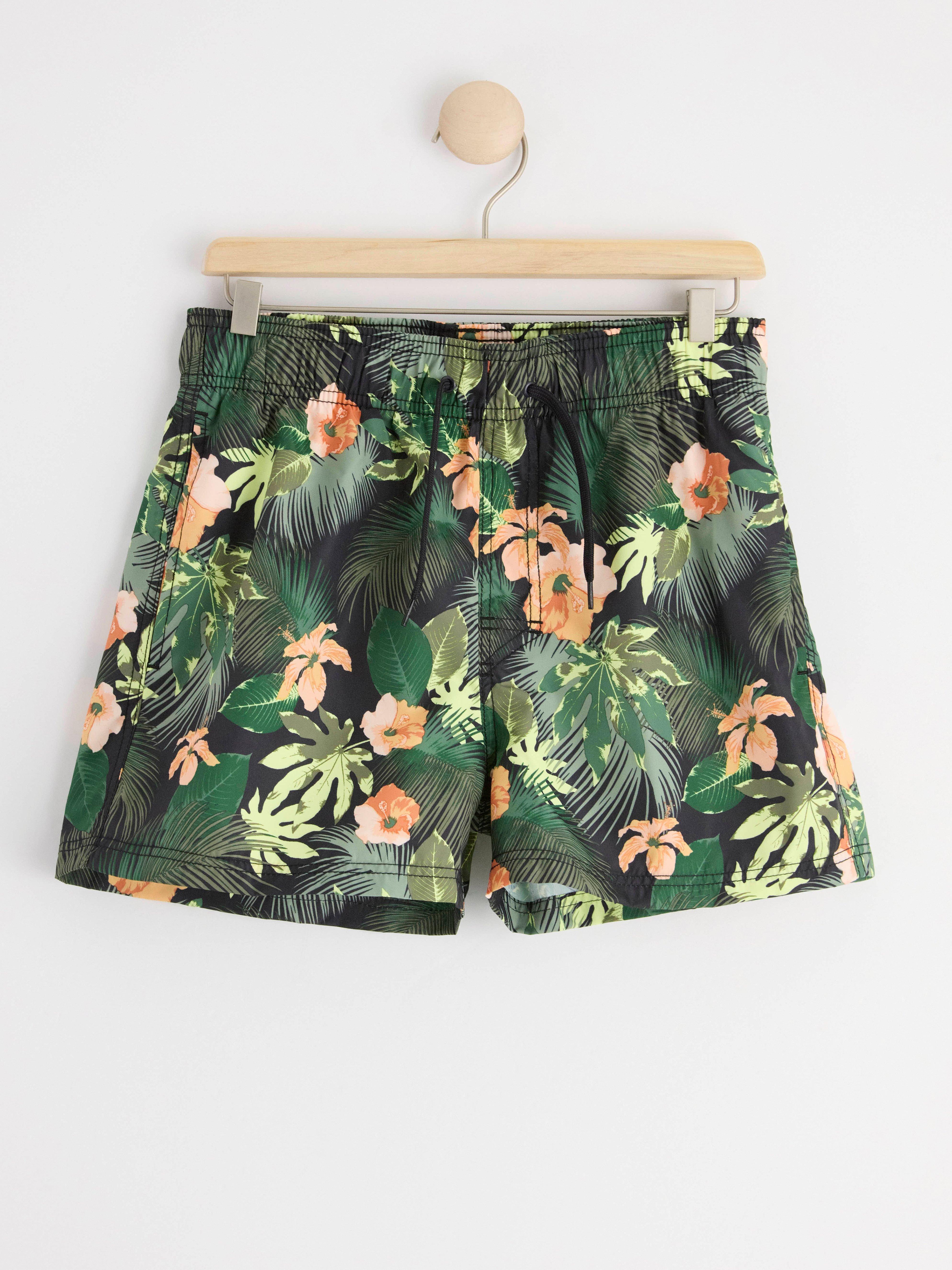 Badshorts med tropiskt mönster