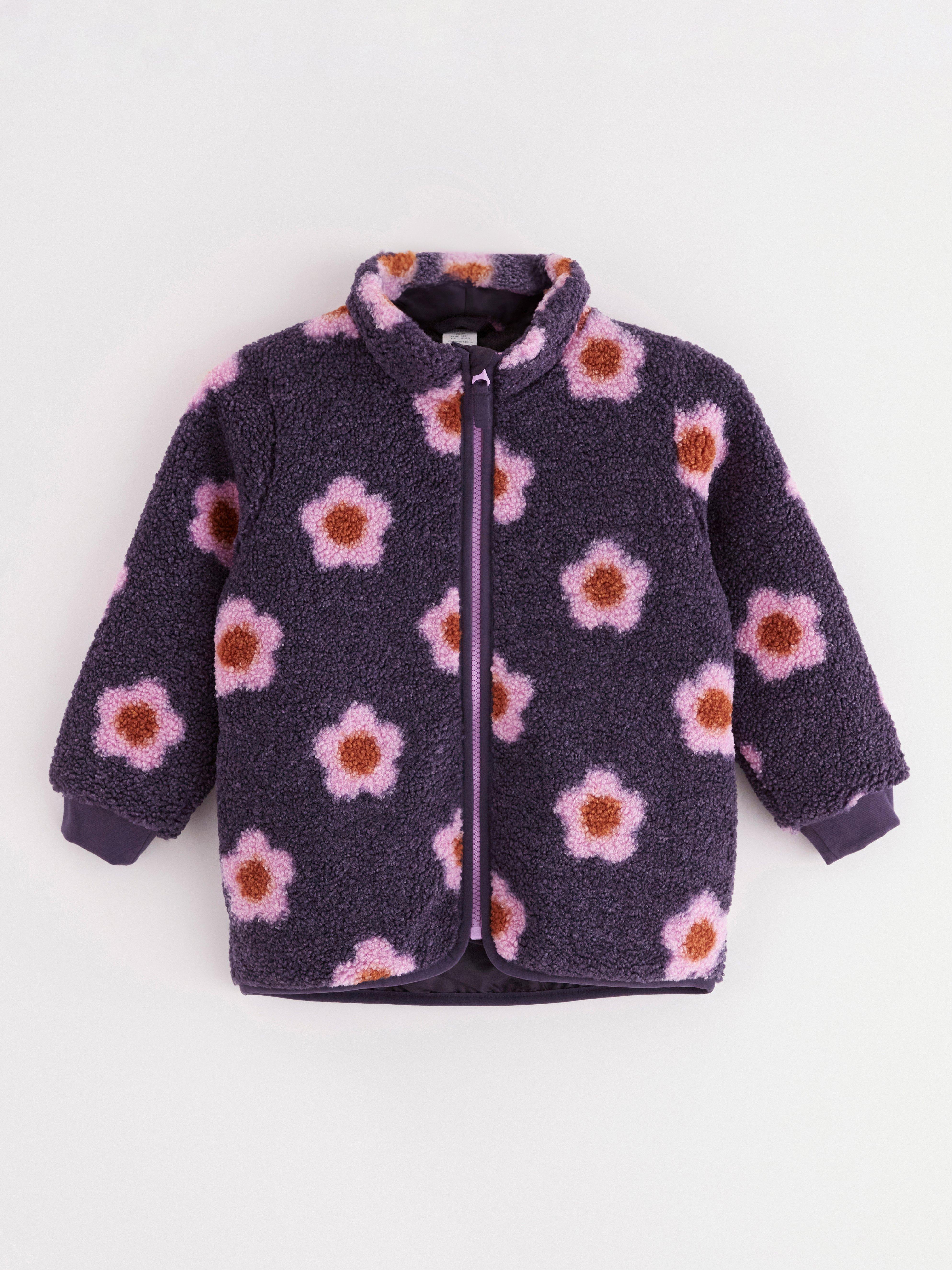 Pilejacka med blommor