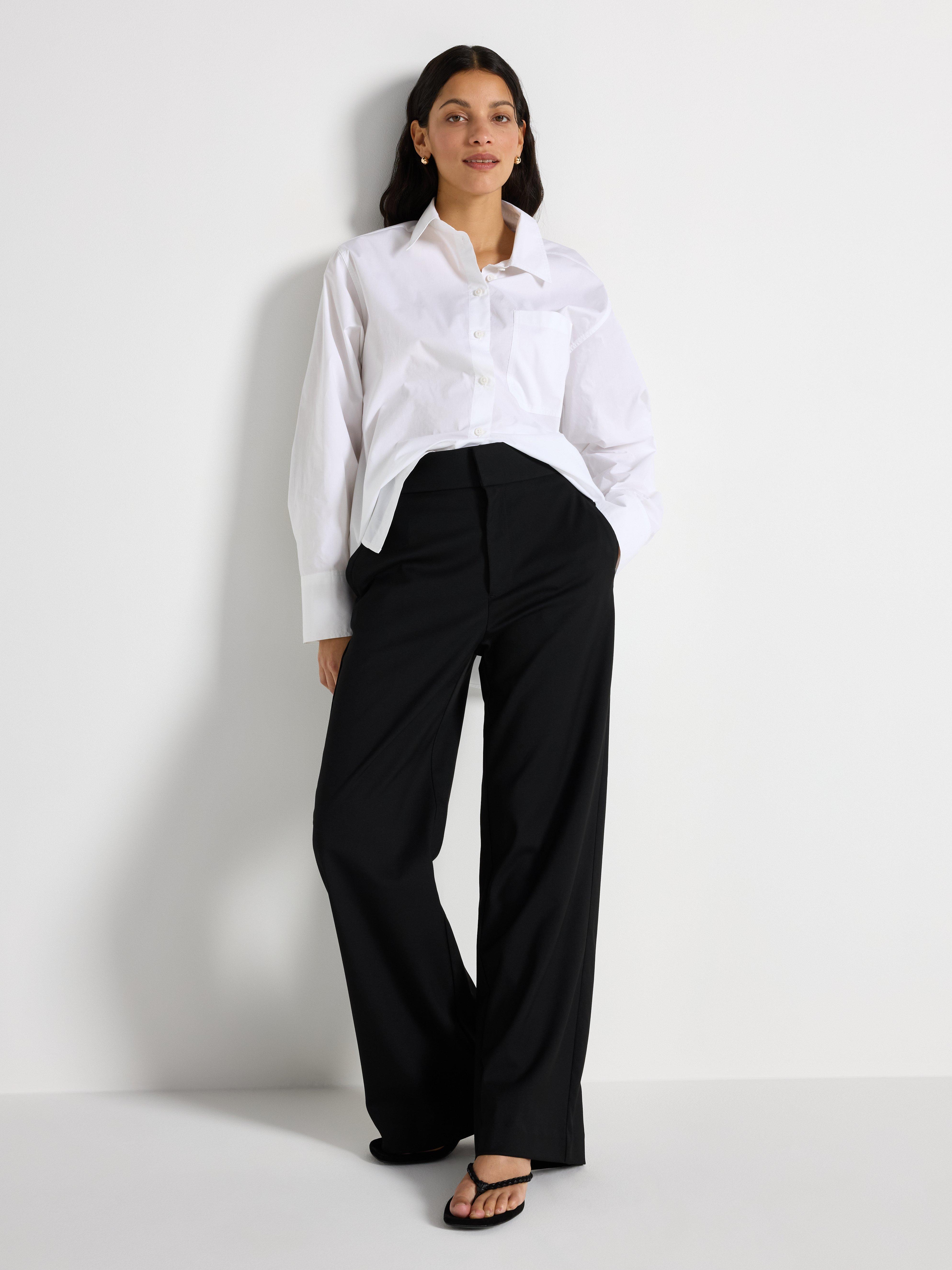 A woman dressed in a classic style.