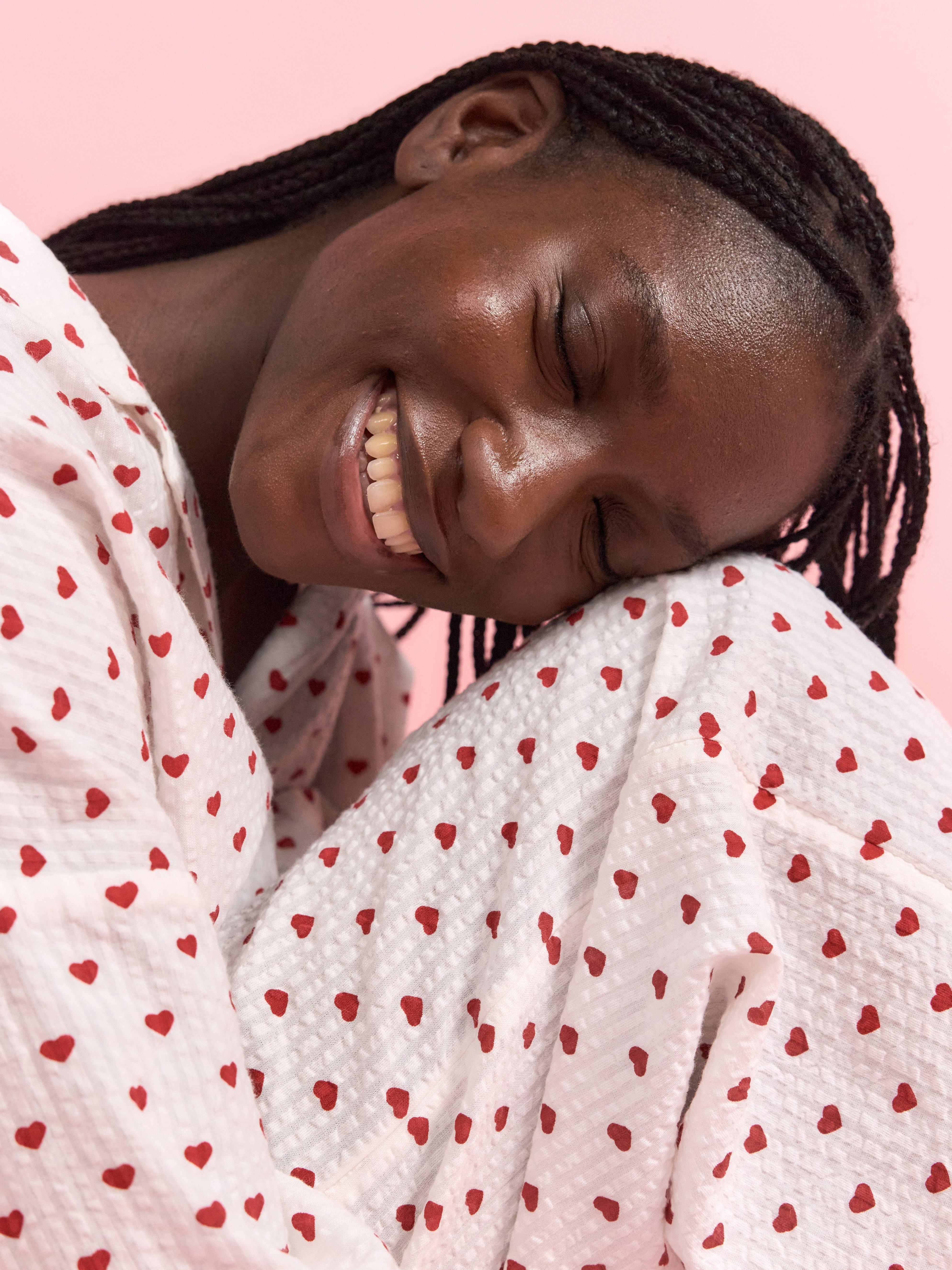 Woman in heart pyjamas