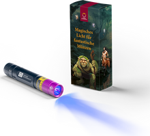 Mit der UV-Taschenlampe können die Münzen angestrahlt werden und beginnen zu leuchten.