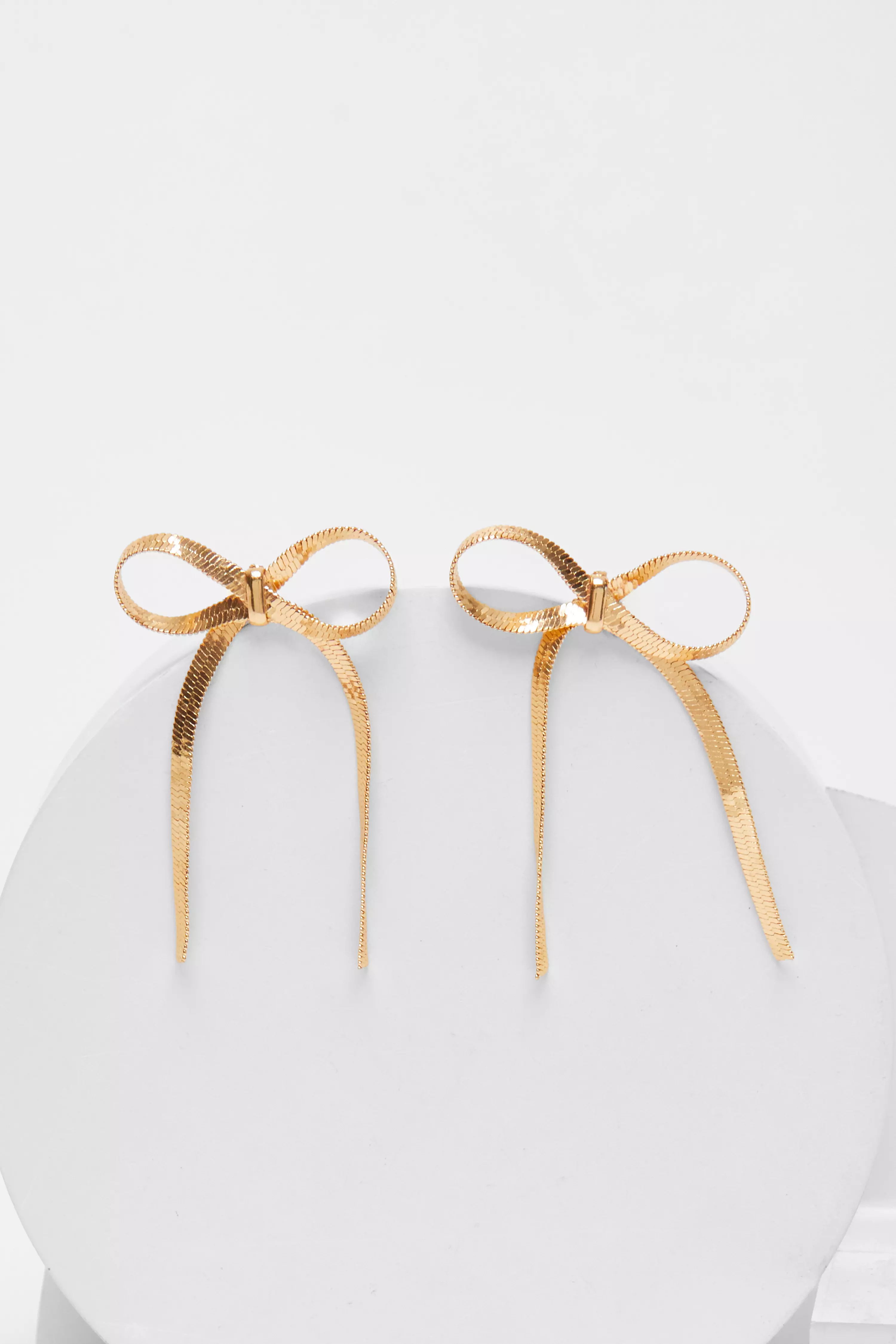 Gold Slinky Metal Drop Bow Earrings QUIZ Clothing