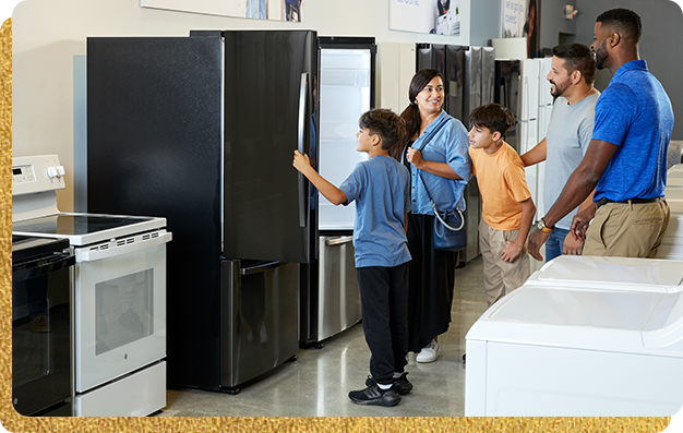 Family looking at refrigerators.