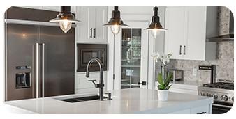 Woman kneeling on kitchen floor painting cabinets. Paint buckets. Shelf with dishes.