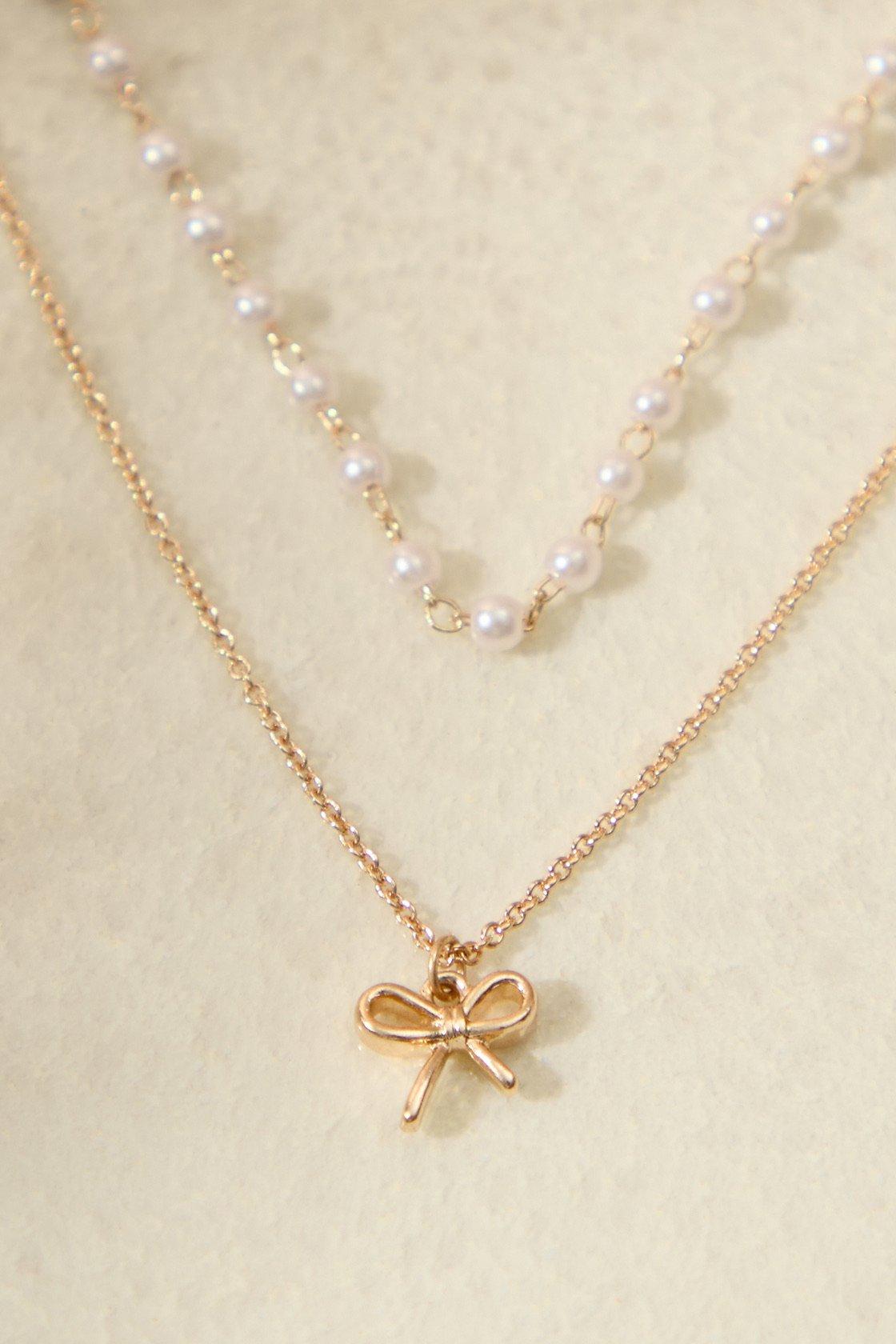 bow charm pearl layered necklace