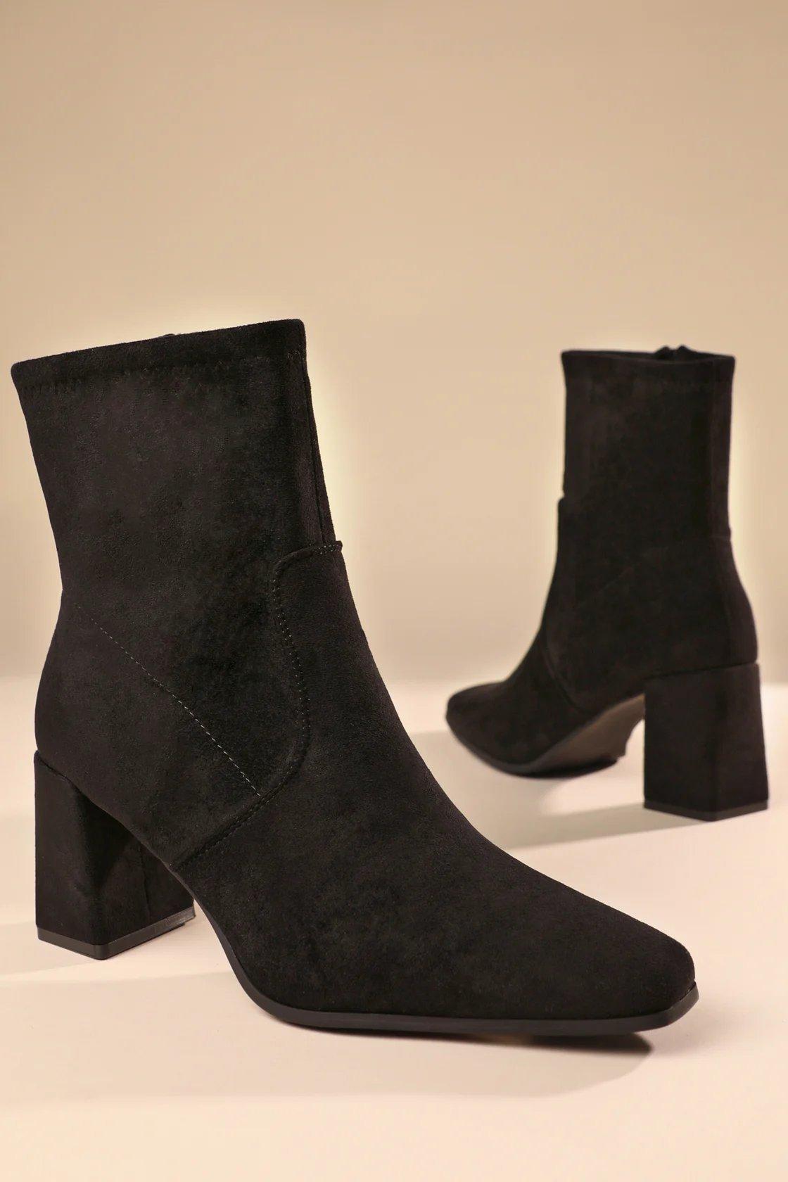 black heeled ankle boots