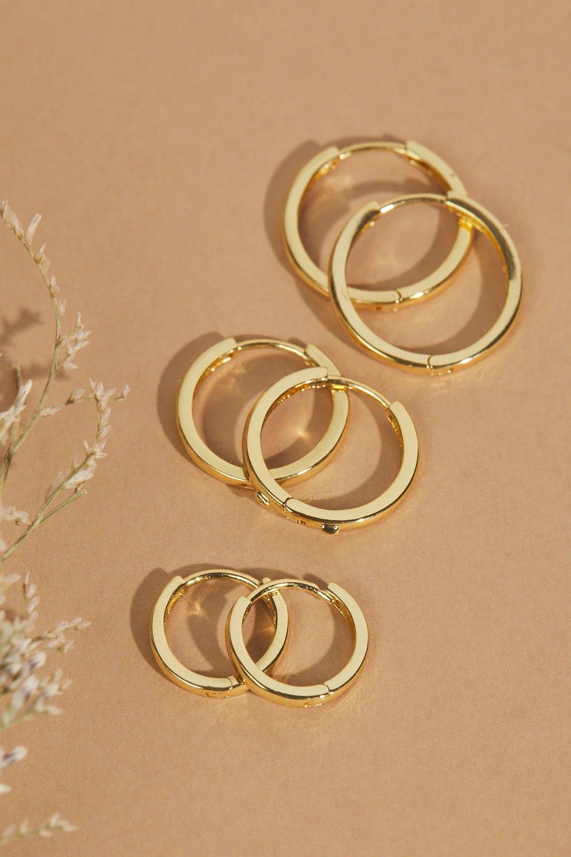 3 sizes of gold dipped hoop earrings