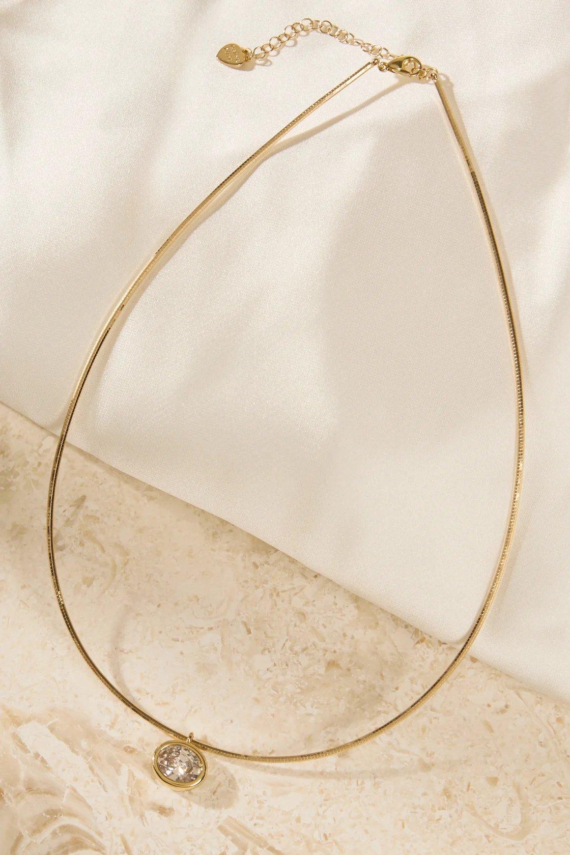 oval pendant gold colored necklace