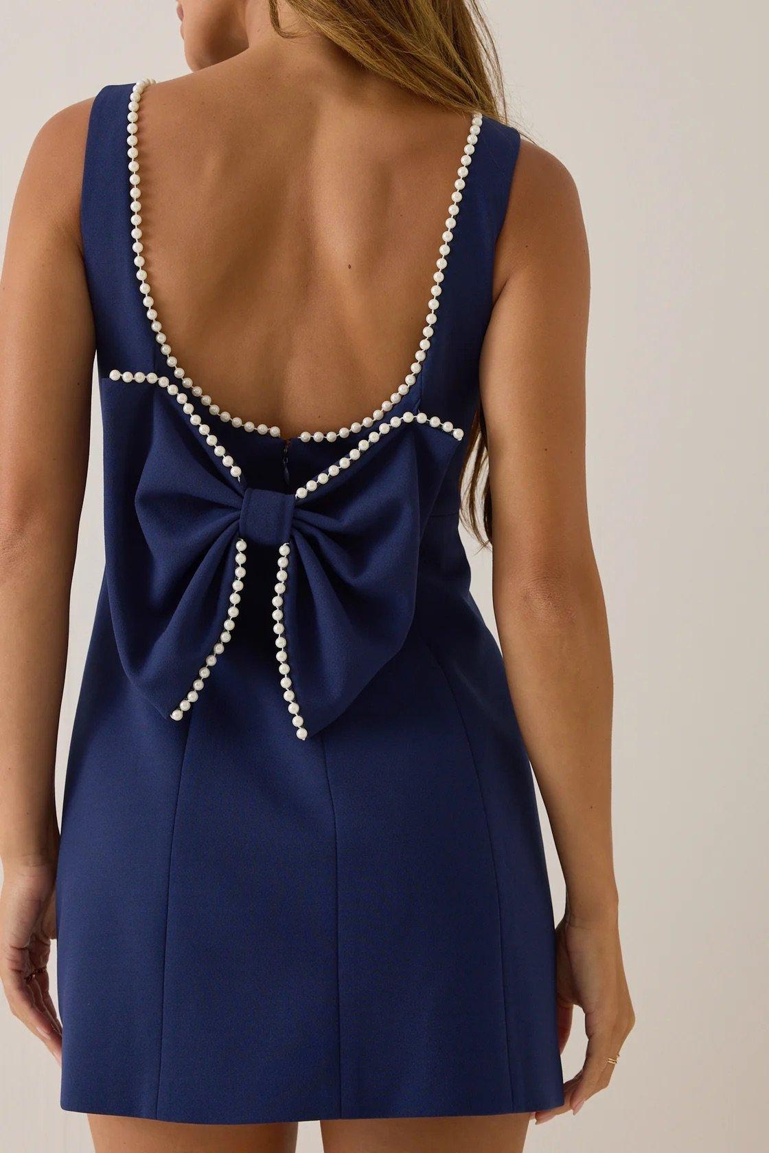 blue high neck mini dress, pearl lined with statement back bow