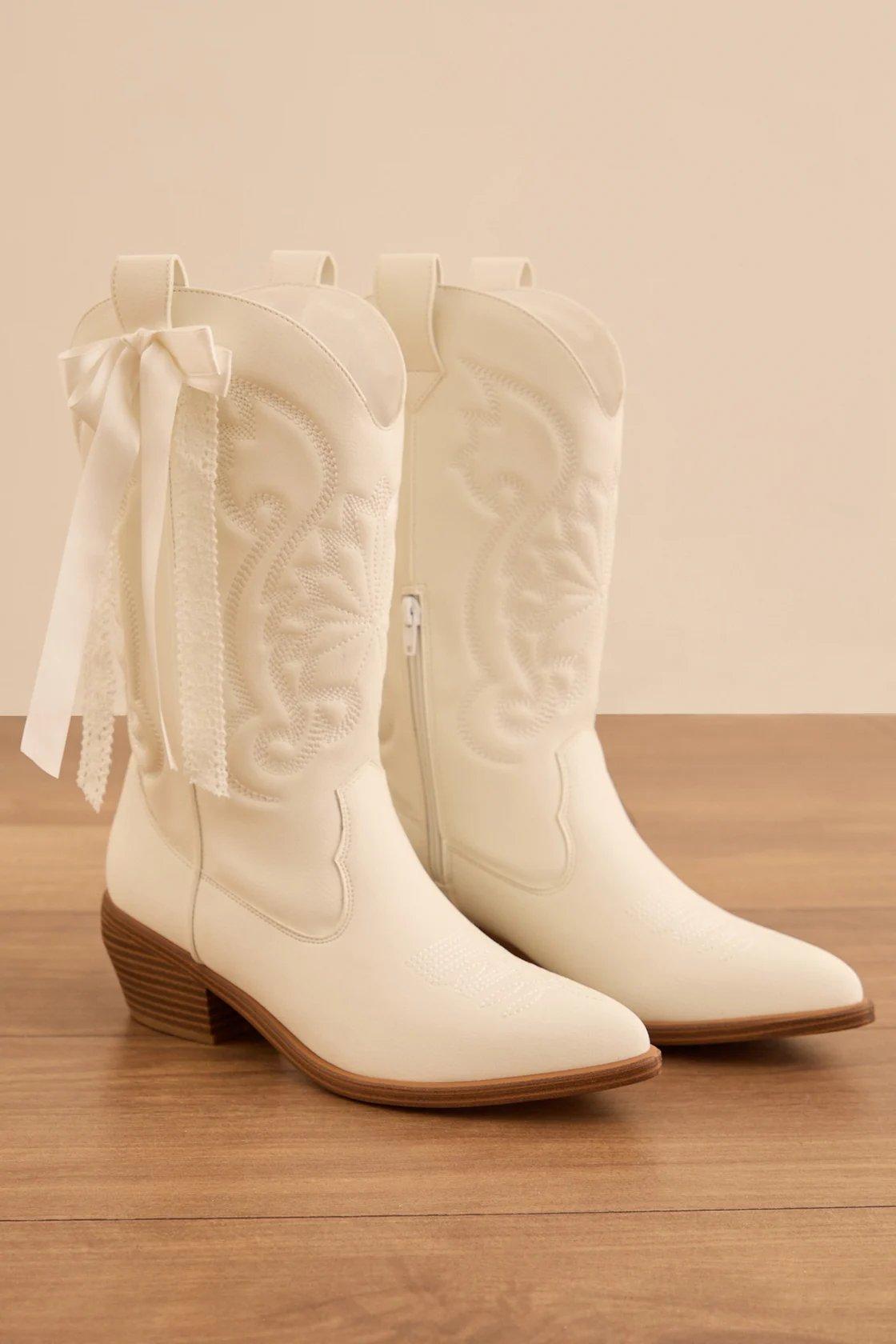 white western boots with white ribbon bow