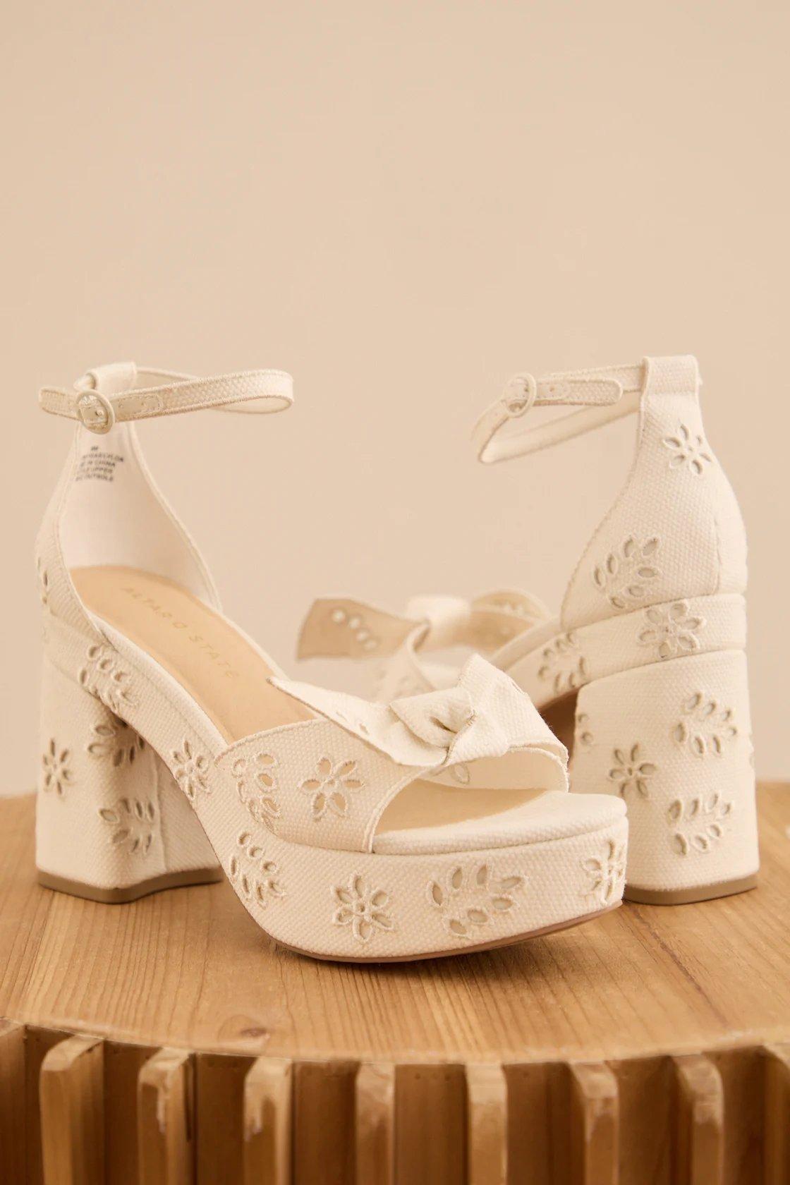 white eyelet platform heels