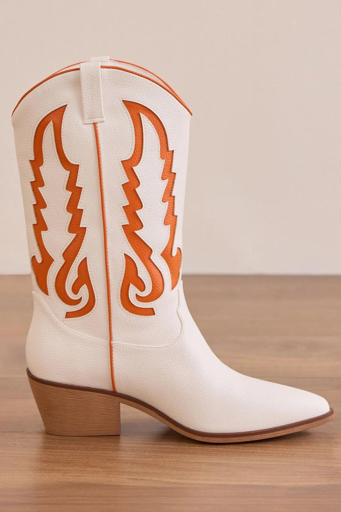 white cowboy boot with orange detailing
