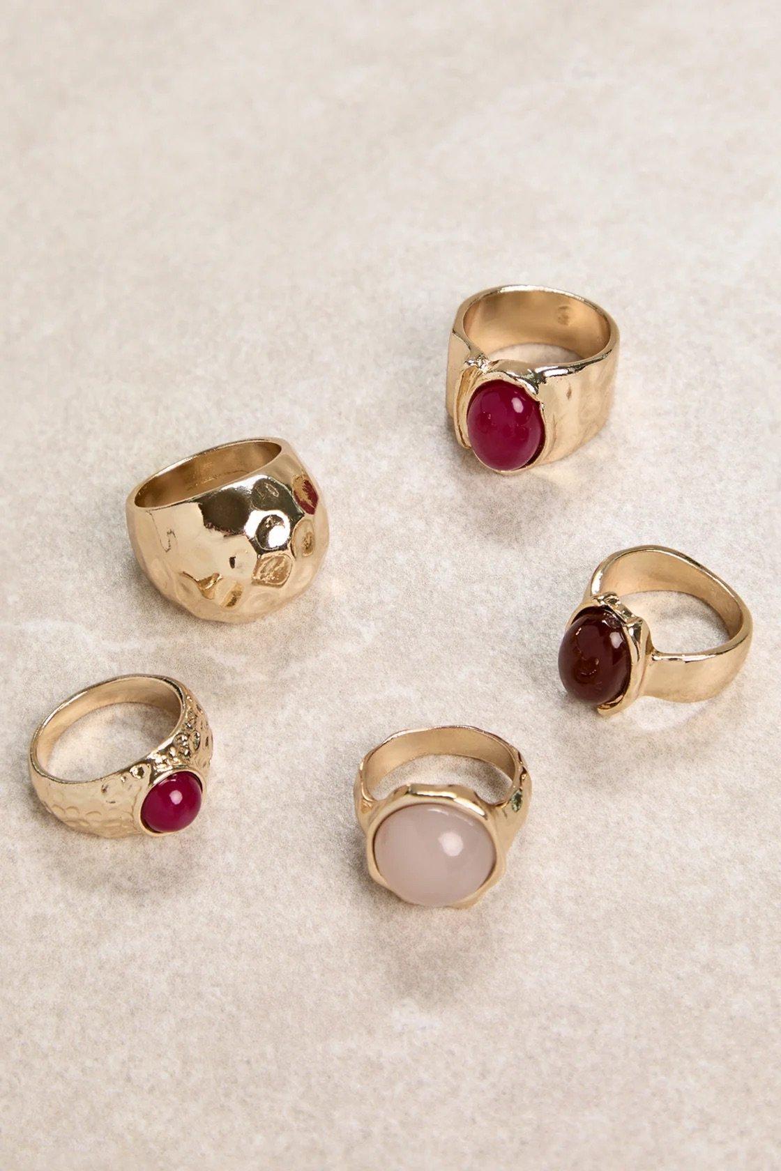 five-pack chunky ring set with gold, red, and pearlescent details