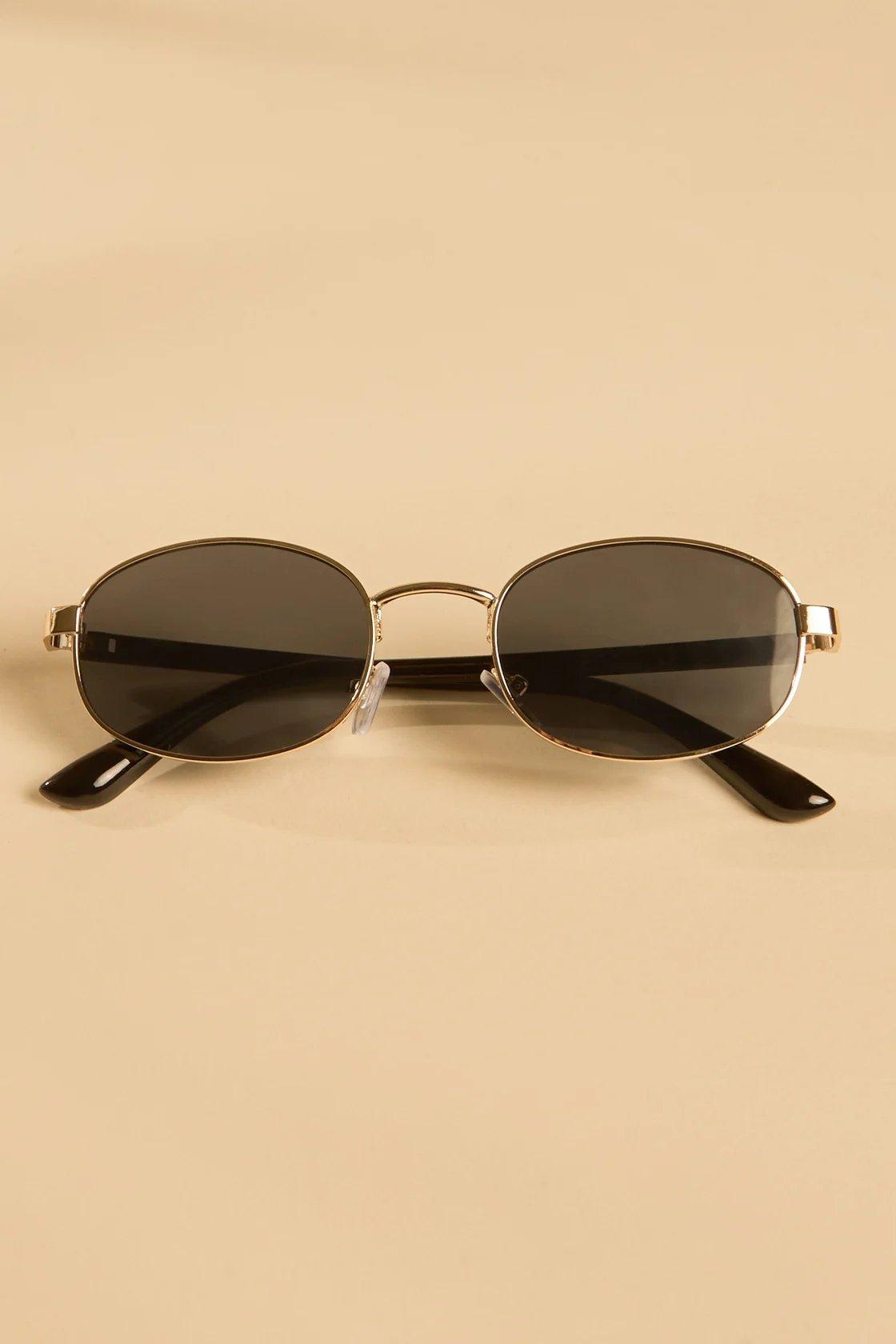 black and gold oval sunglasses