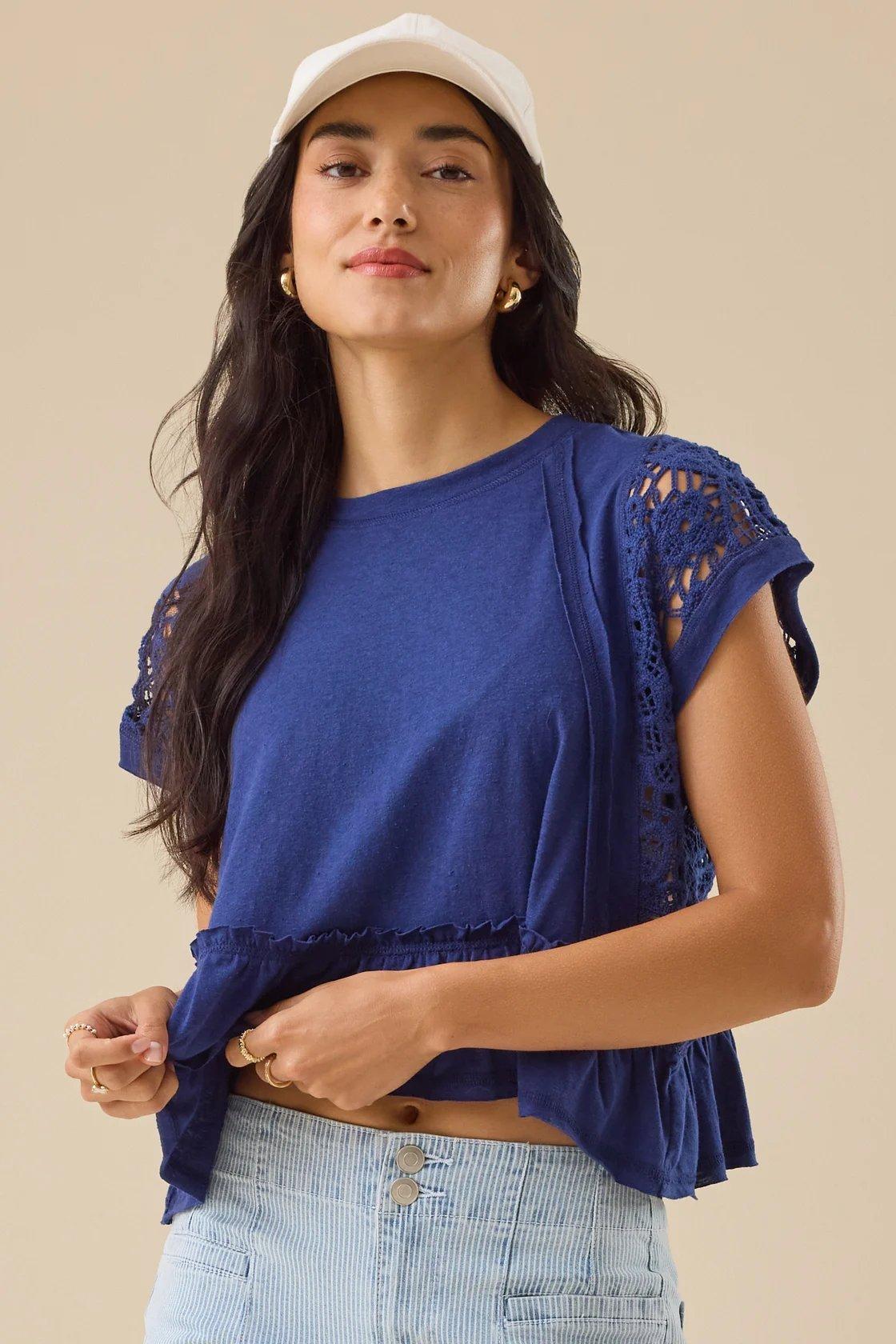 navy blue peplum top with crocheted detailing