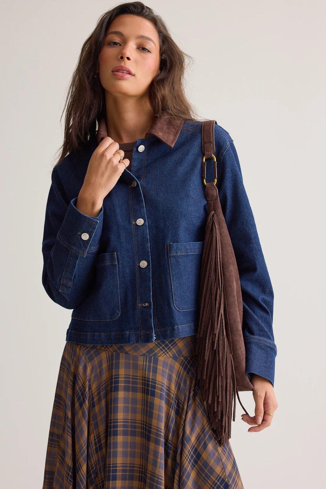 dark wash denim jacket with a suede collar