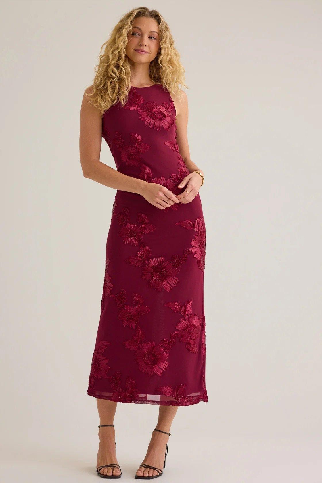 red maxi dress with floral fabric embellishment 