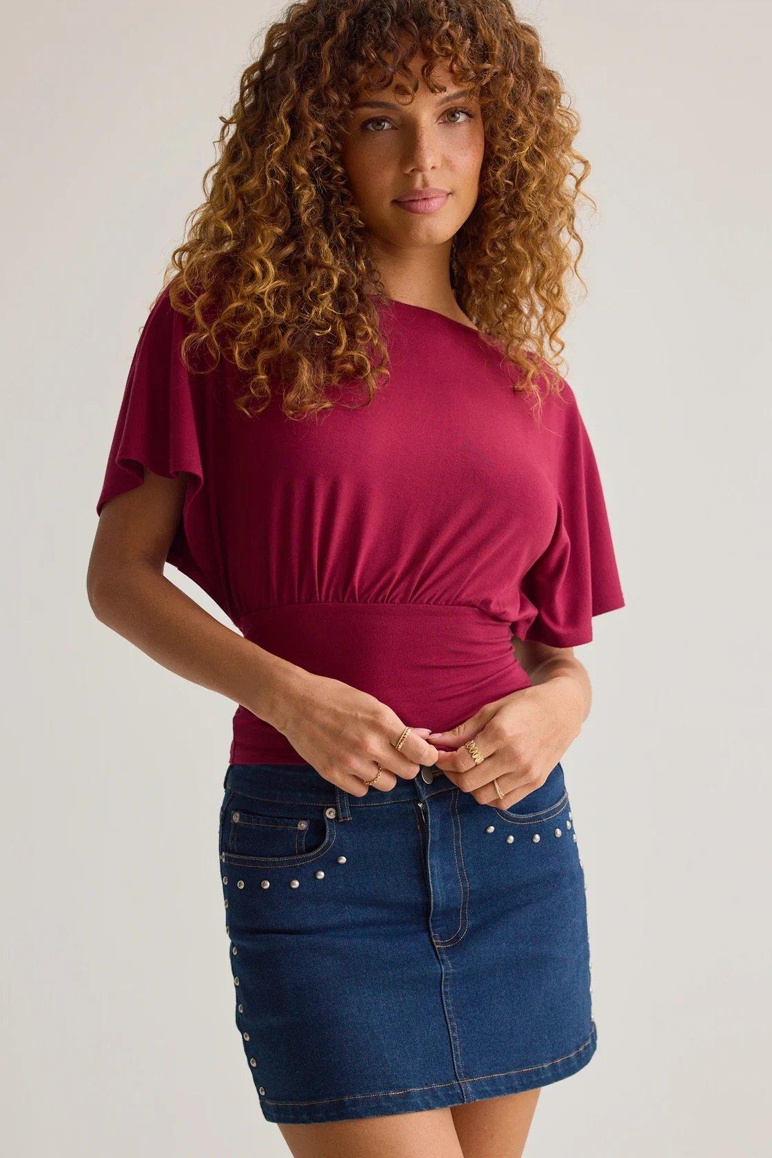 red boatneck top with cinched tie back