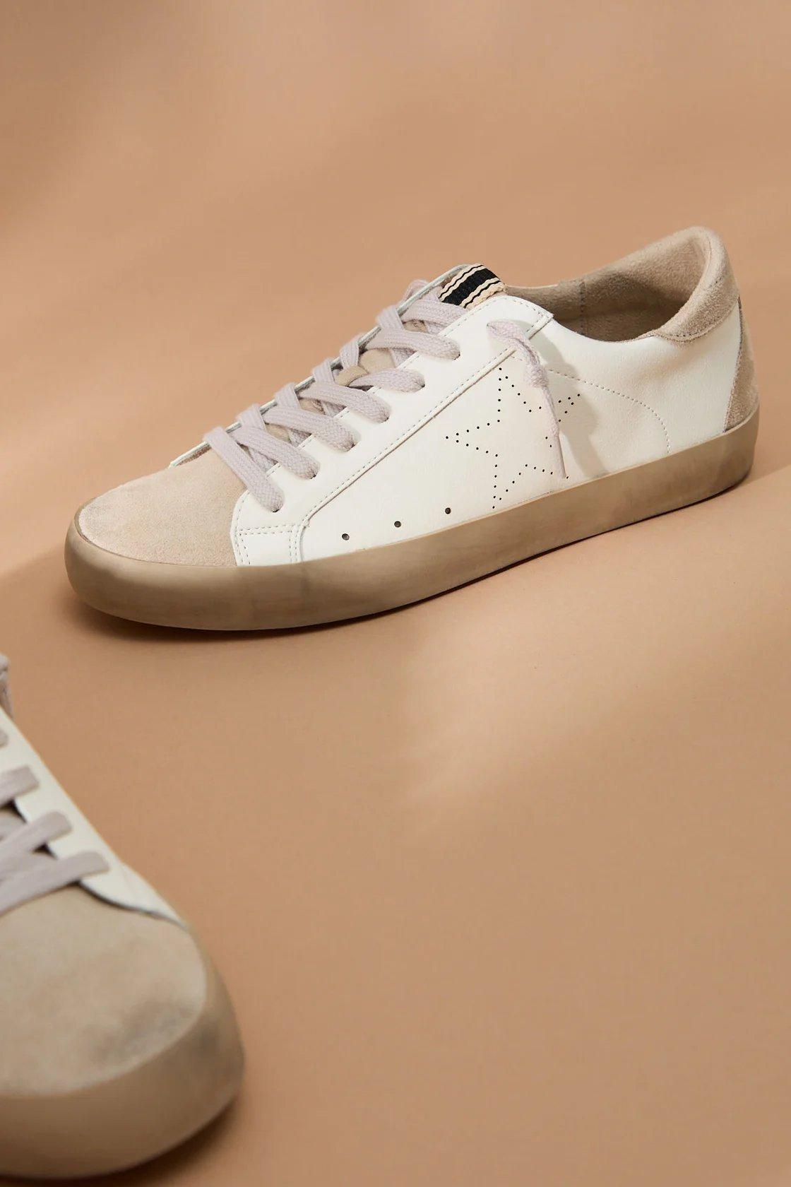 white and tan fashion sneakers