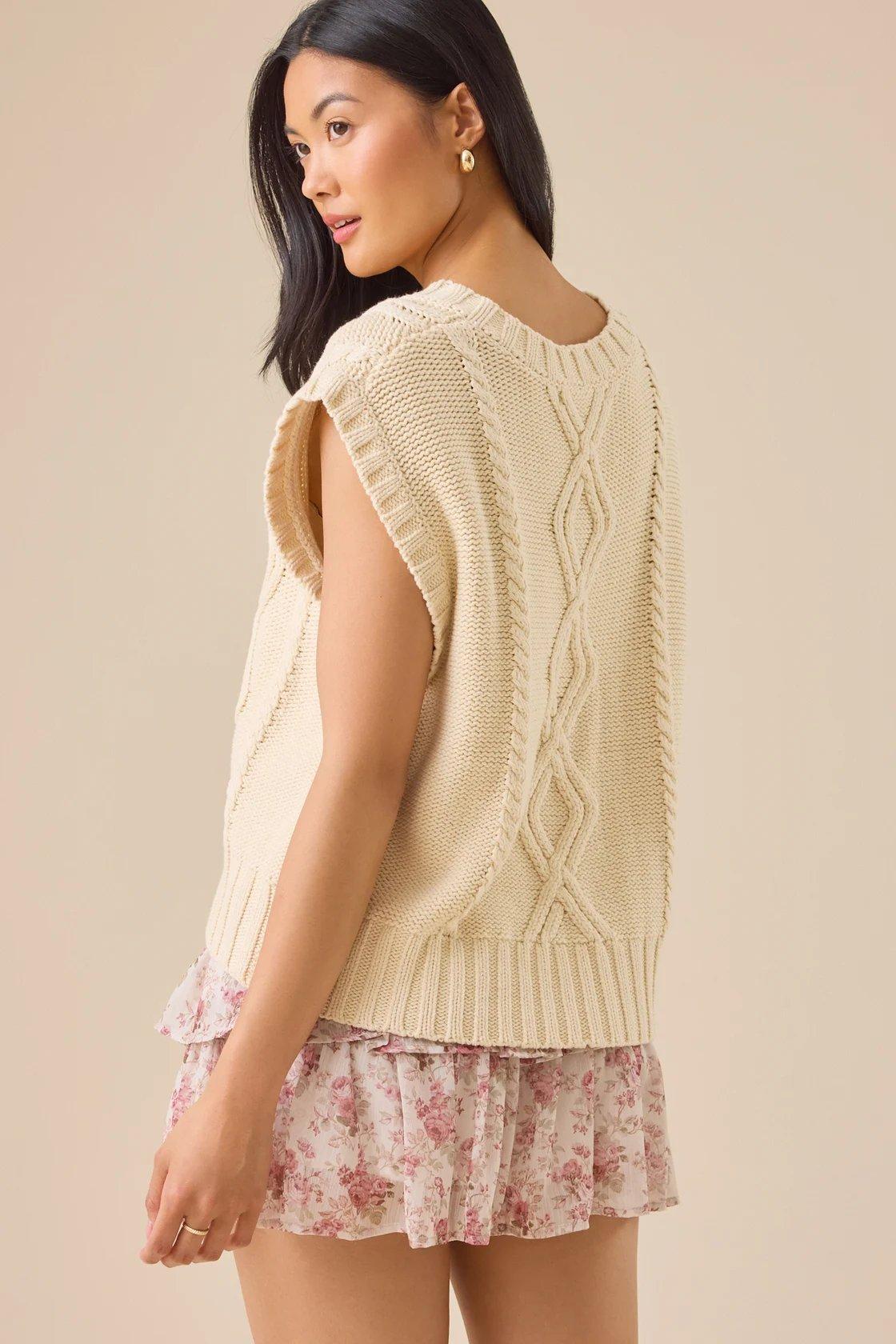 cream cable-knit oversized sweater