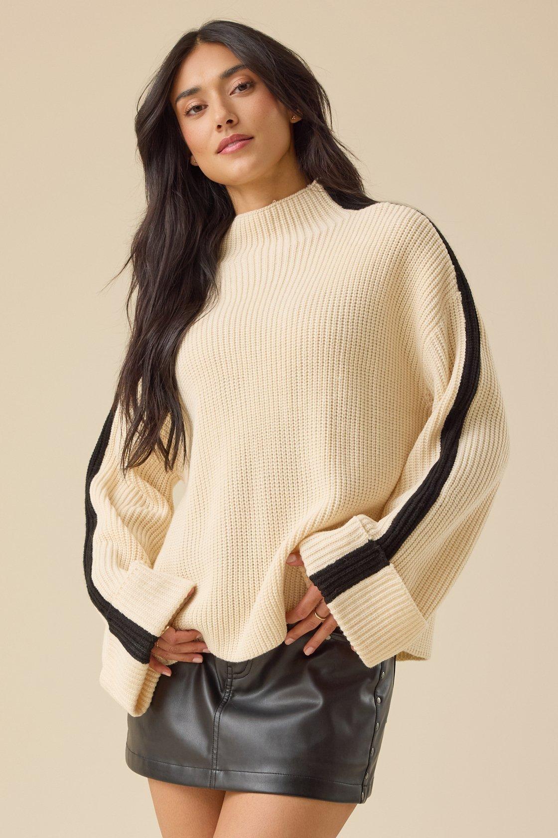 off white mock neck sweater with black stripe