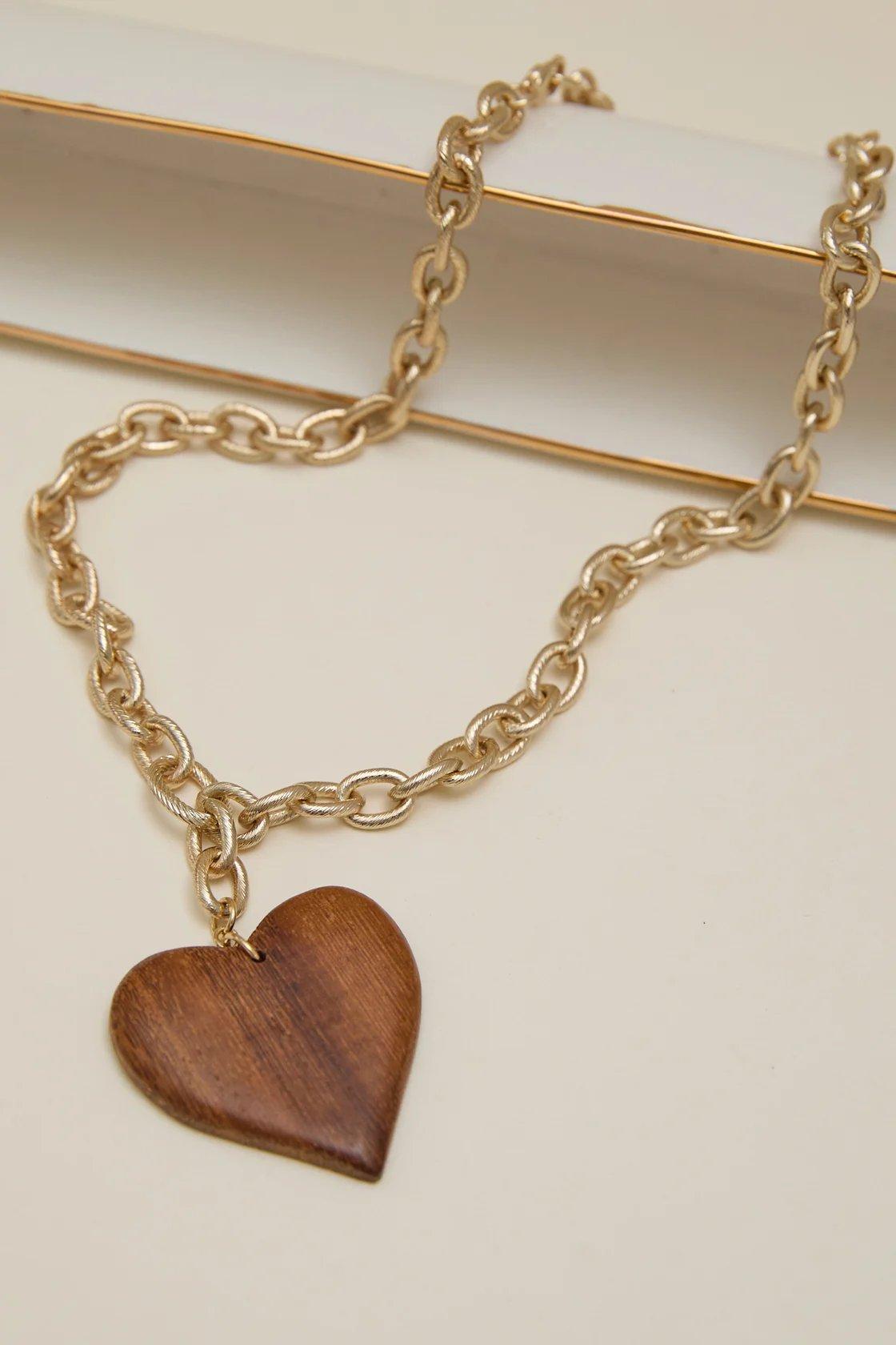 Gold toned necklace with a wooden heart