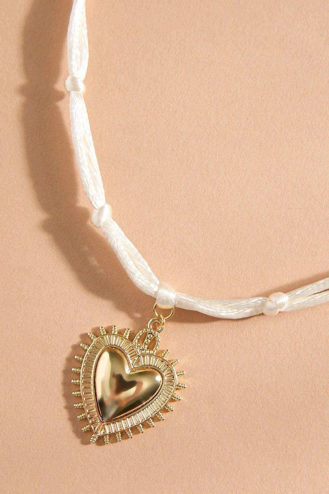 corded necklace with heart pendant