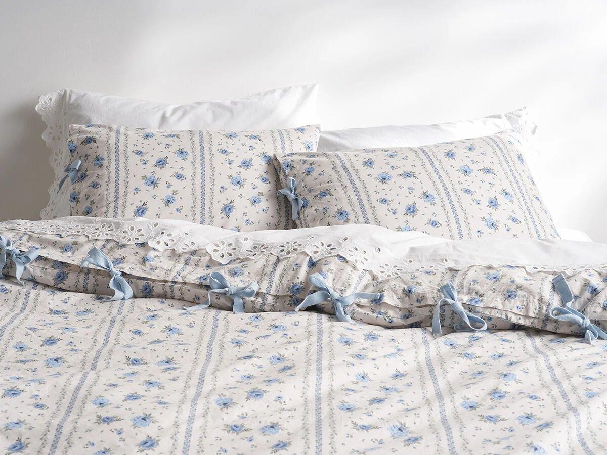 white and blue floral patterned duvet 