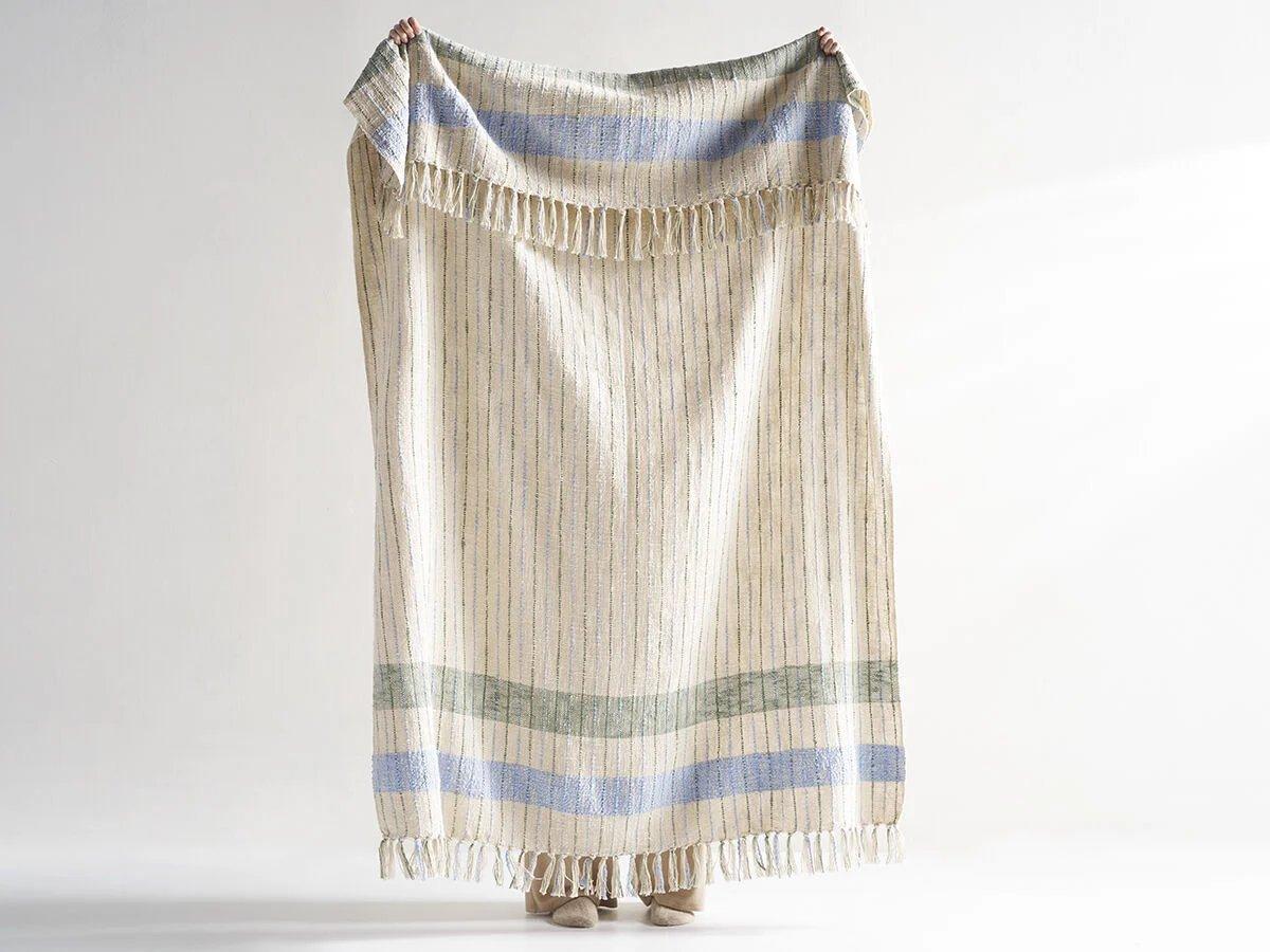 blue and green striped throw
