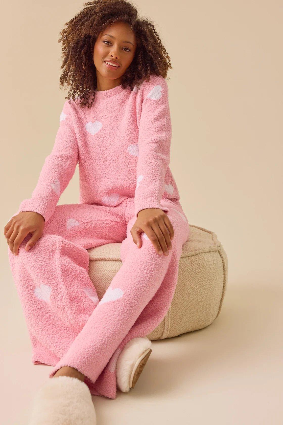 pink long sleeve pullover with white hearts