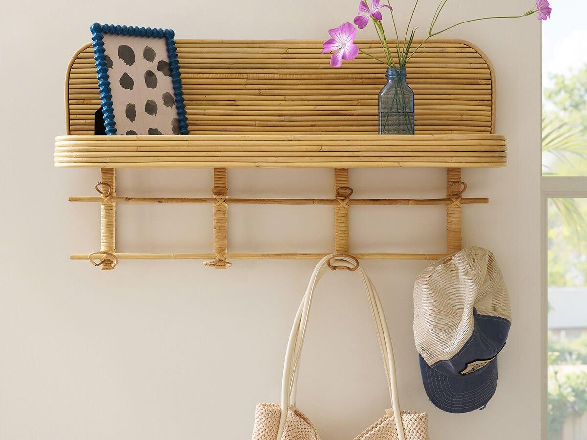 Rattan wall shelf with item hooks
