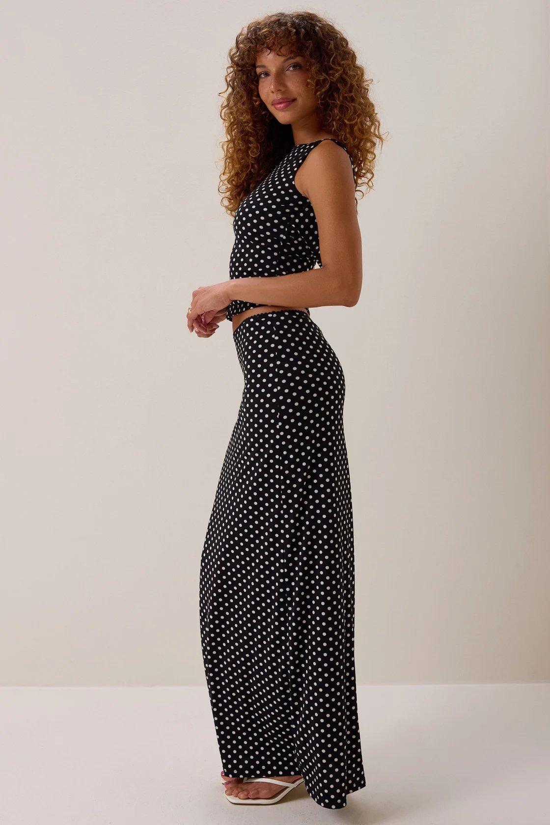 black skirt and top matching set with white polka dots