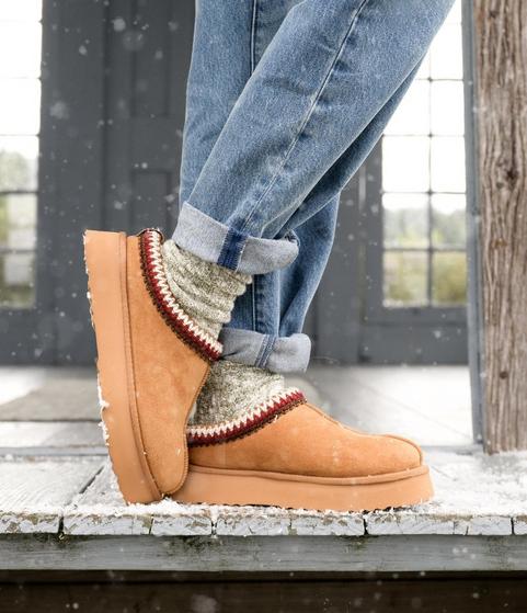 Women wearing tan slippers