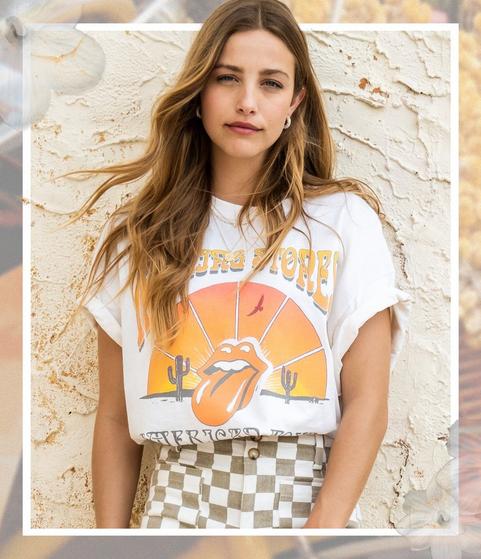 Woman wearing a graphic tee and checkered cargo pants