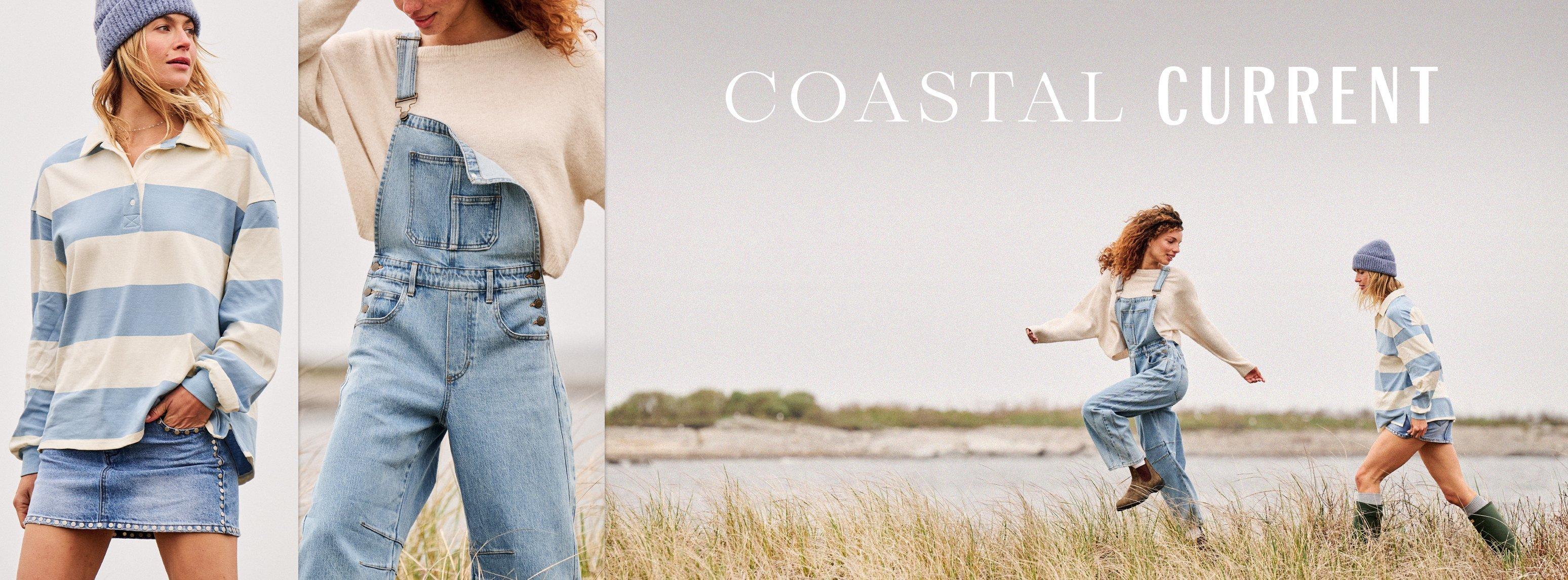 Two girls wearing denim and running through a field