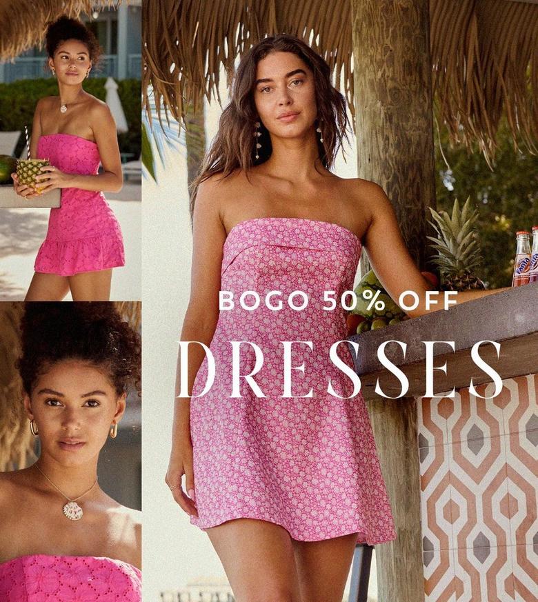 Two girls wearing pink dresses outside