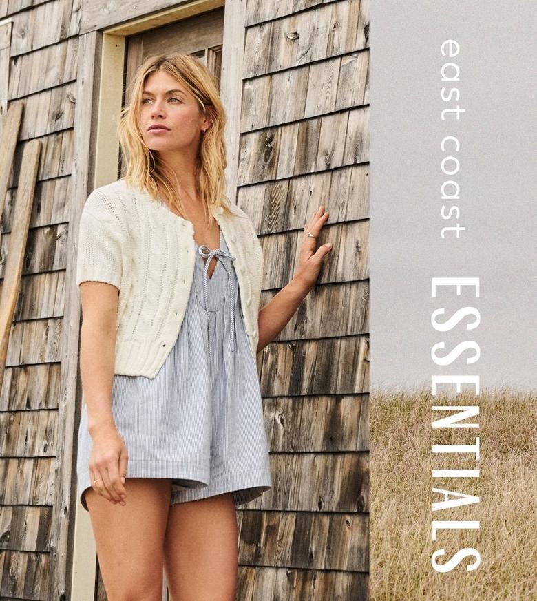 Girl wearing a light blue romper and short sleeve cardigan