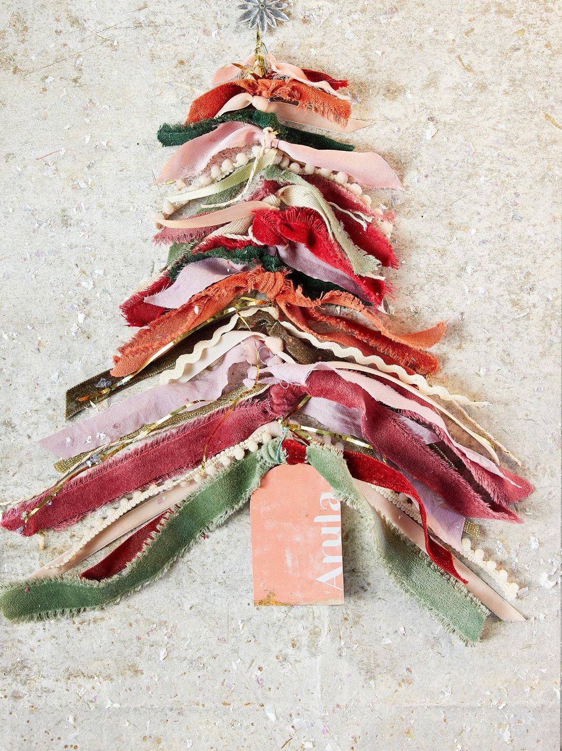 Physical gift card surrounded by ribbon