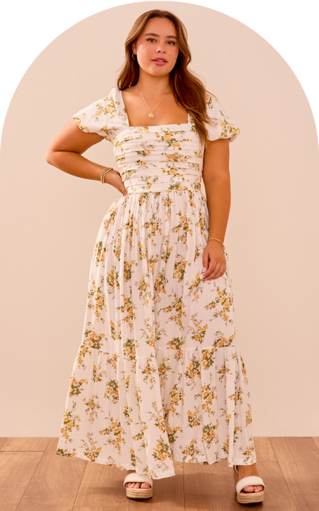 woman wearing a white floral maxi dress