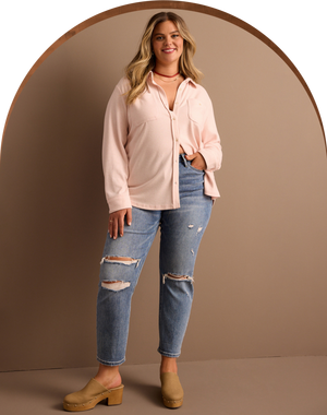 woman wearing a button down shirt and jeans