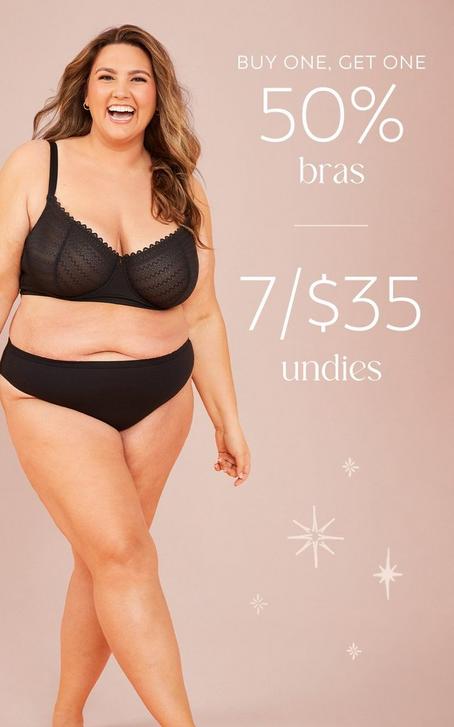 Woman wearing matching black bra and undies set