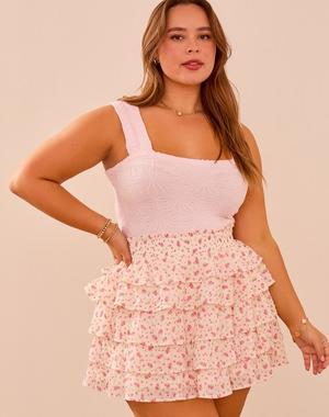 woman wearing white and pink ruffle mini skirt