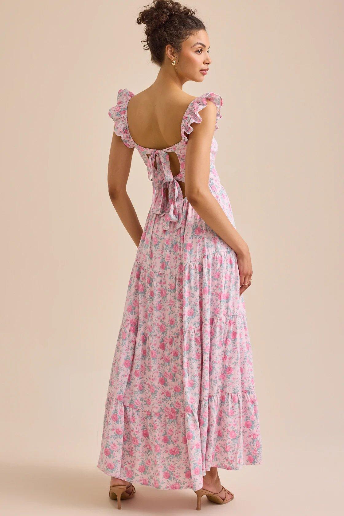 girl wearing a pink floral maxi dress